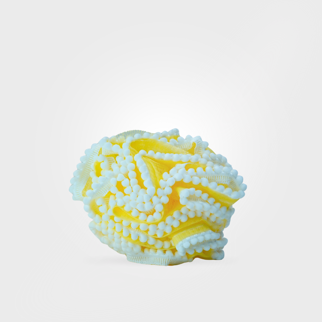 Yellow and white textured ball on a light gray background