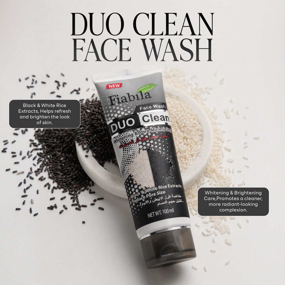 A tube of Fiabila Duo Clean Face Wash is displayed diagonally on a white background, surrounded by scattered black rice grains on the left and white rice grains on the right, with a small white dish holding the grains. Text overlays describe the ingredients and benefits of the face wash.