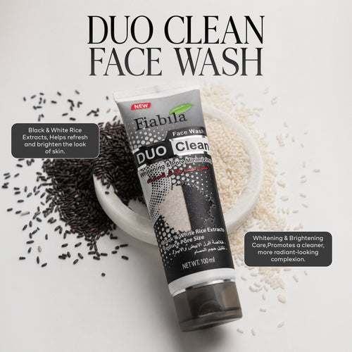 A tube of Fiabila Duo Clean Face Wash is displayed diagonally on a white background, surrounded by scattered black rice grains on the left and white rice grains on the right, with a small white dish holding the grains. Text overlays describe the ingredients and benefits of the face wash.