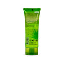 A green squeeze tube of hair care product, shown from the back with Arabic text, a barcode, and certification logos on a white background.