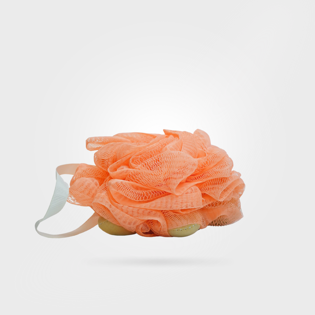 Peach-colored loofah with a white strap on a light gray background
