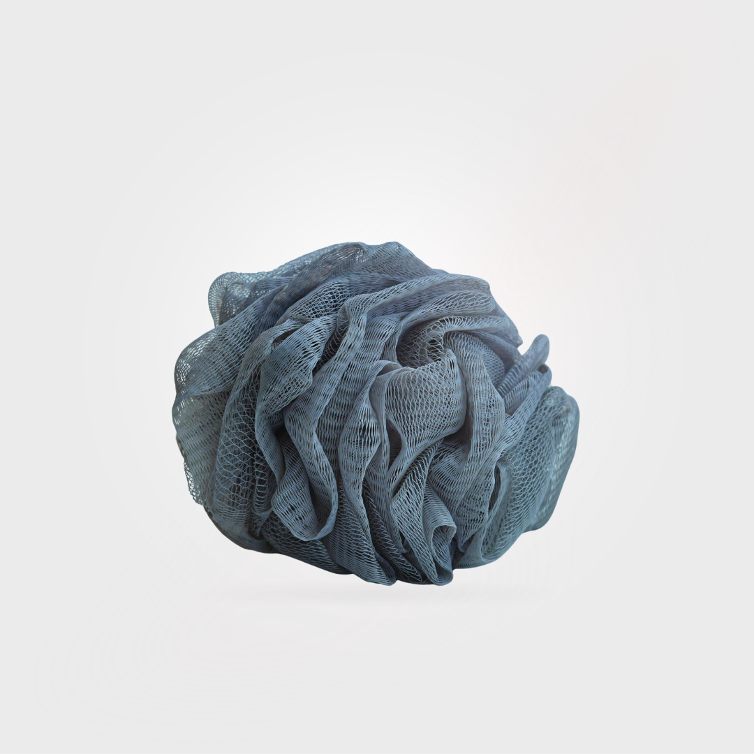 Blue bath pouf on a light gray background