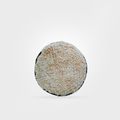 Round beige cushion on a white background