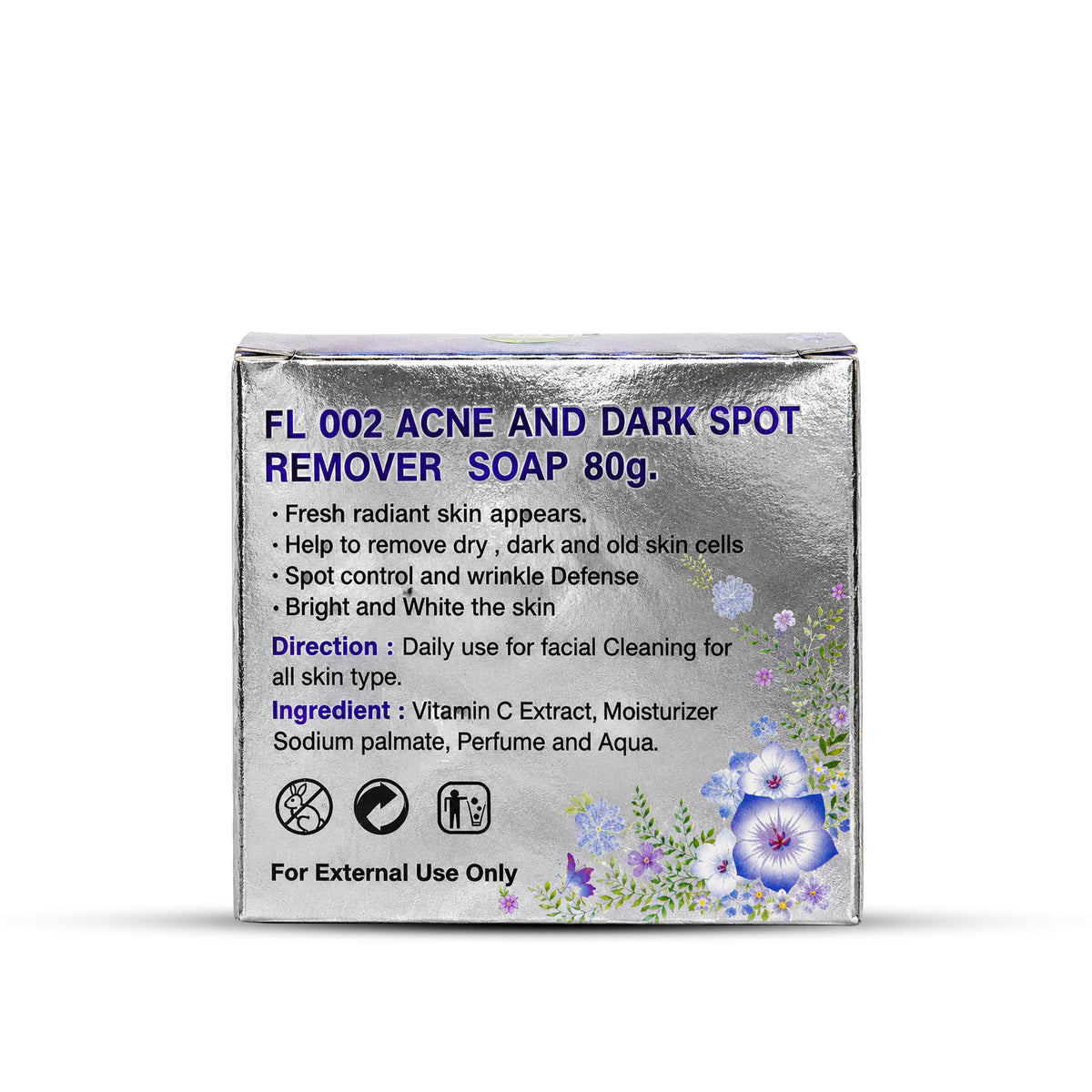 A square silver box of FL 002 Acne and Dark Spot Remover Soap 80g, featuring blue text and purple floral illustrations on a white background.
